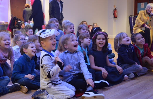 Children laughing and having a great time at Ritchie Rosson's magic show 2018